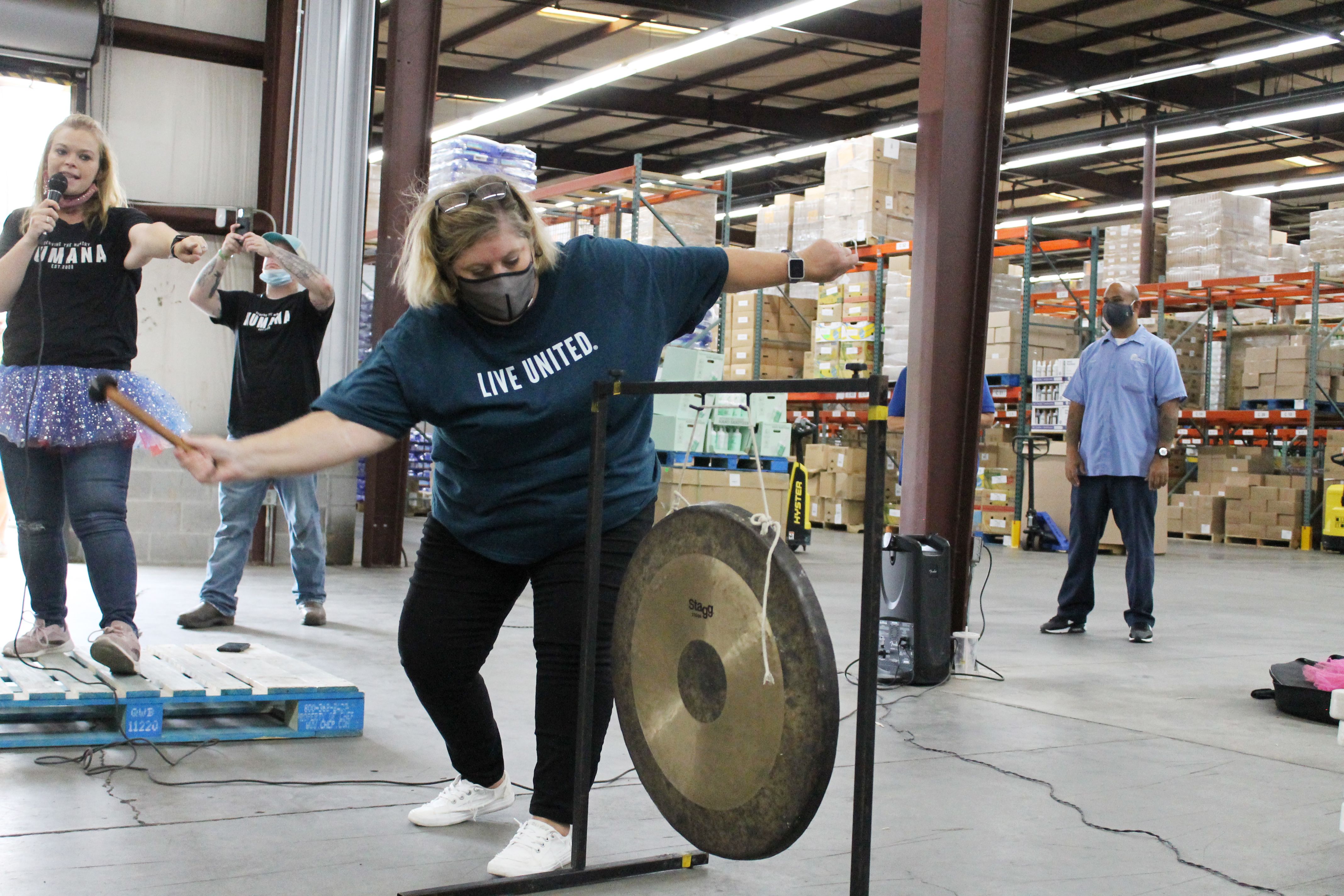 Volunteer hitting a gong