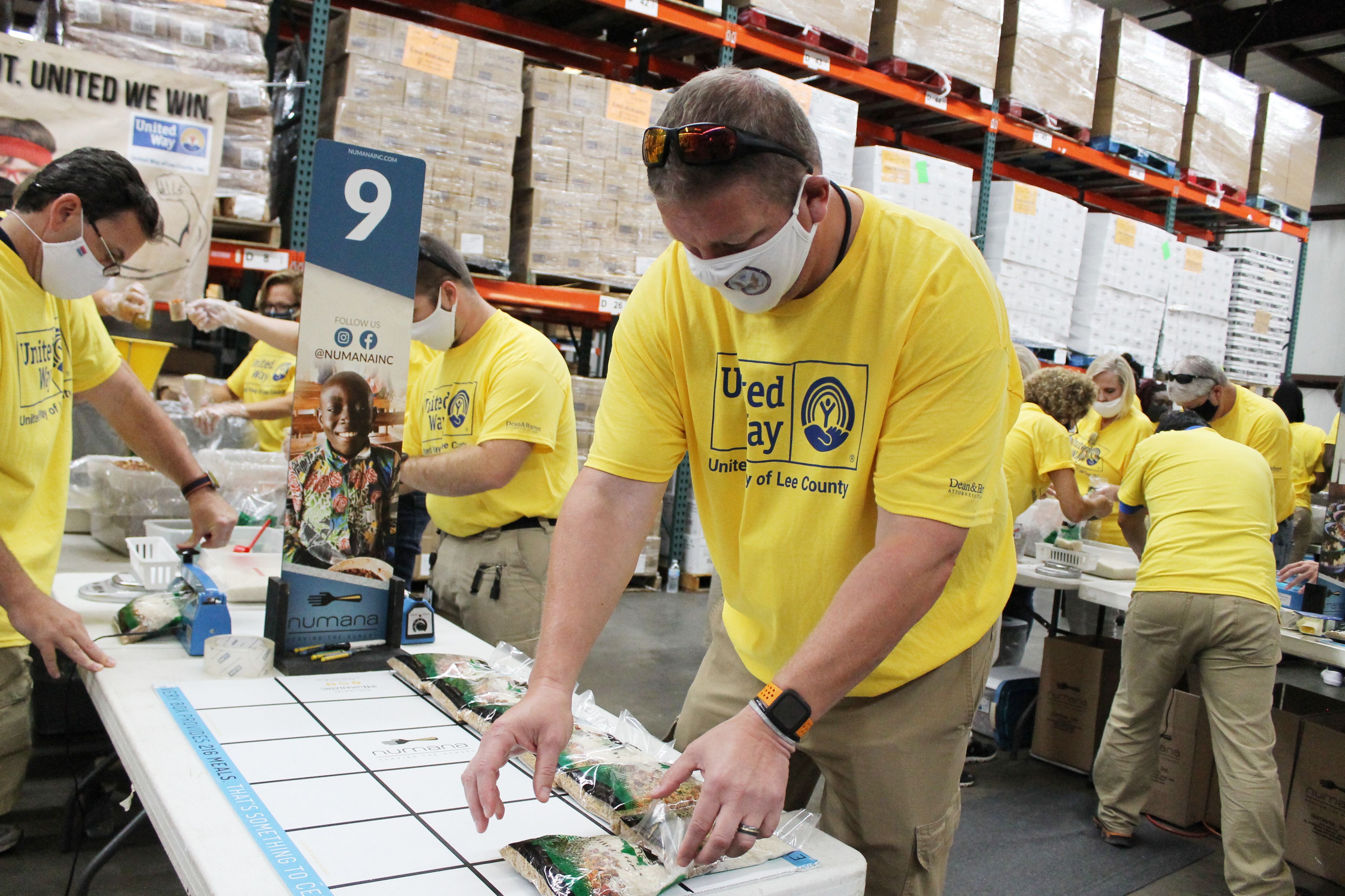 Volunteers packing food