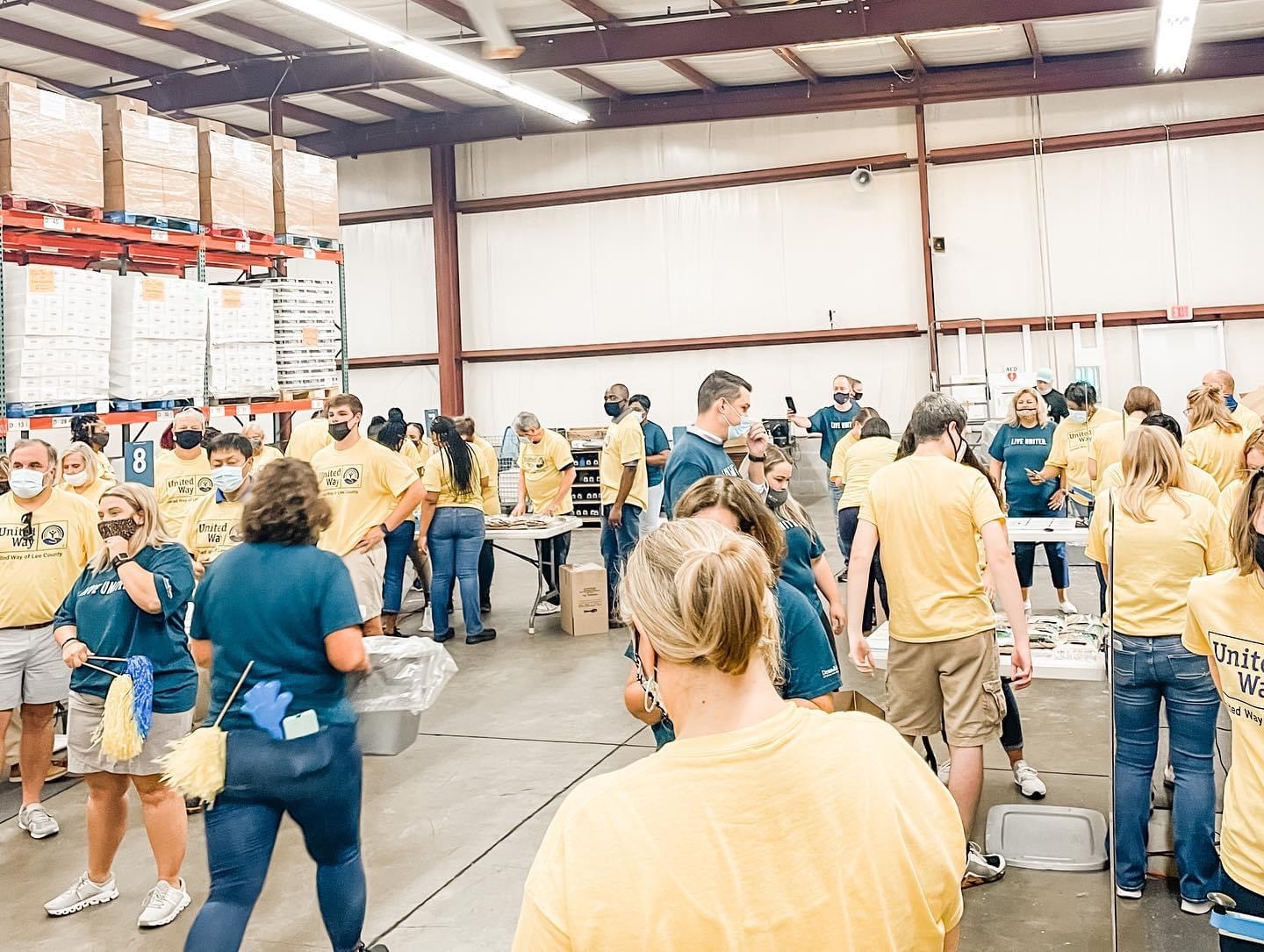 Volunteers packing food