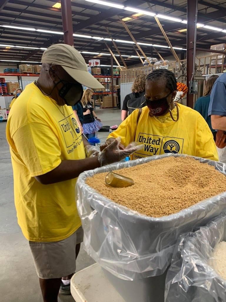 Volunteers packing food