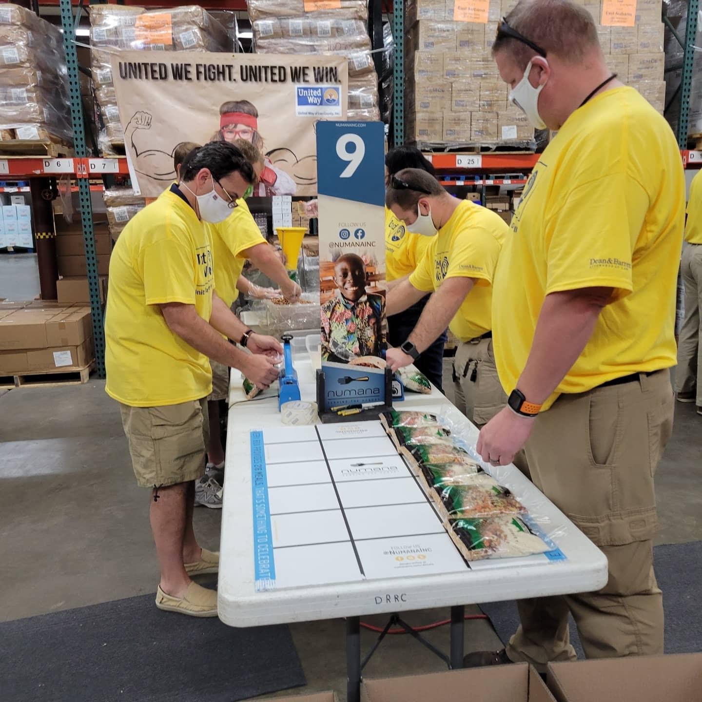 Volunteers packing food