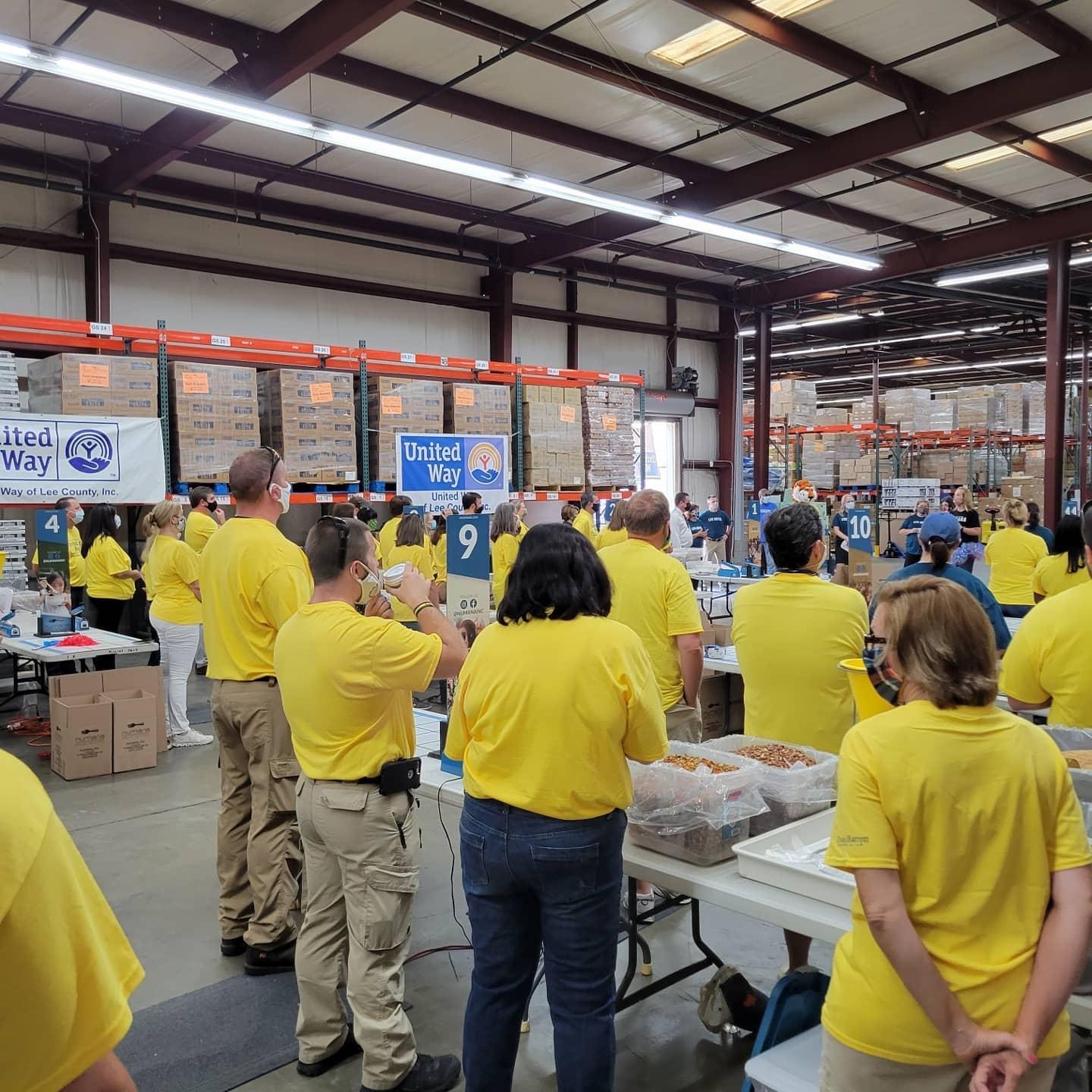 Volunteers packing food