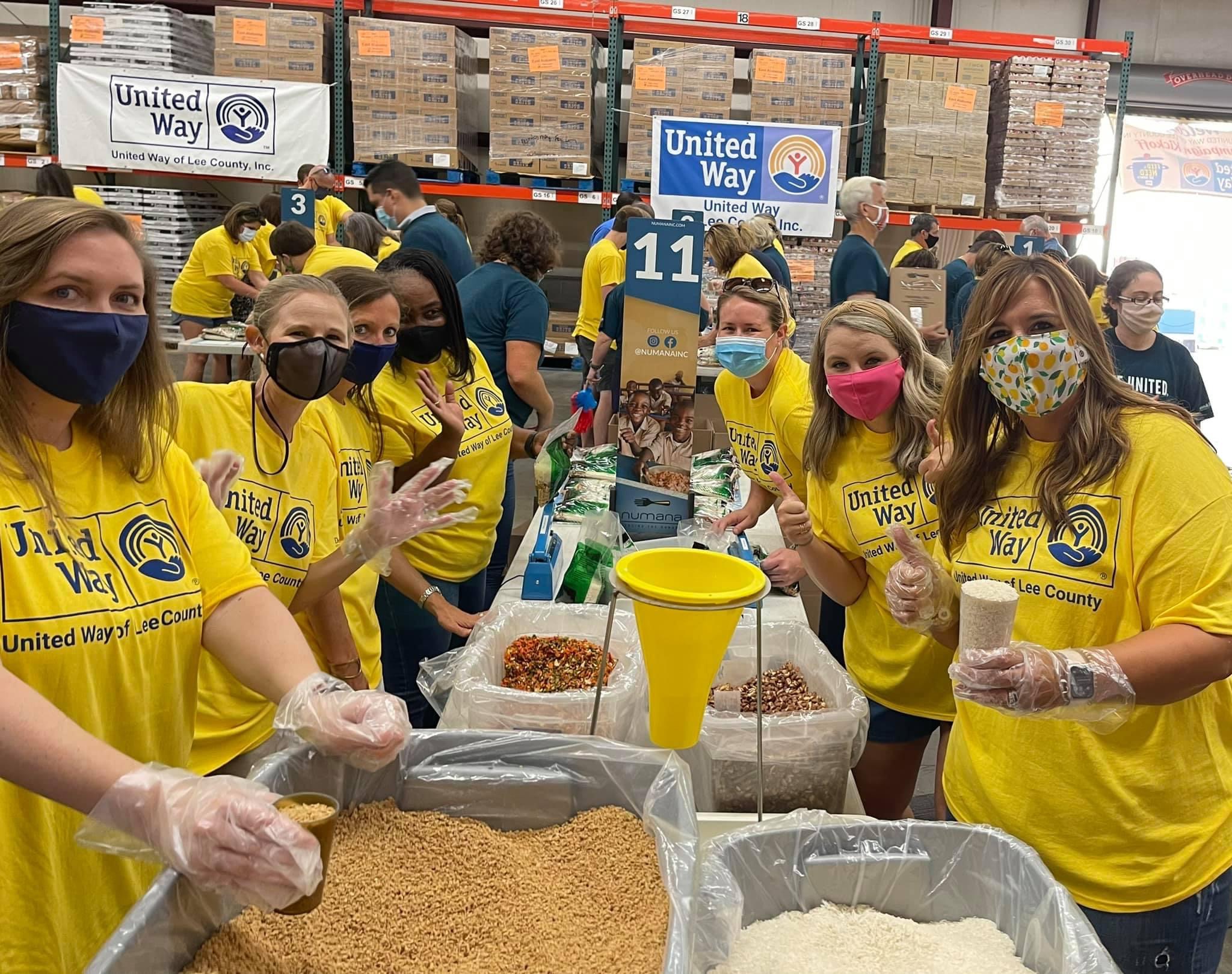 Volunteers packing food