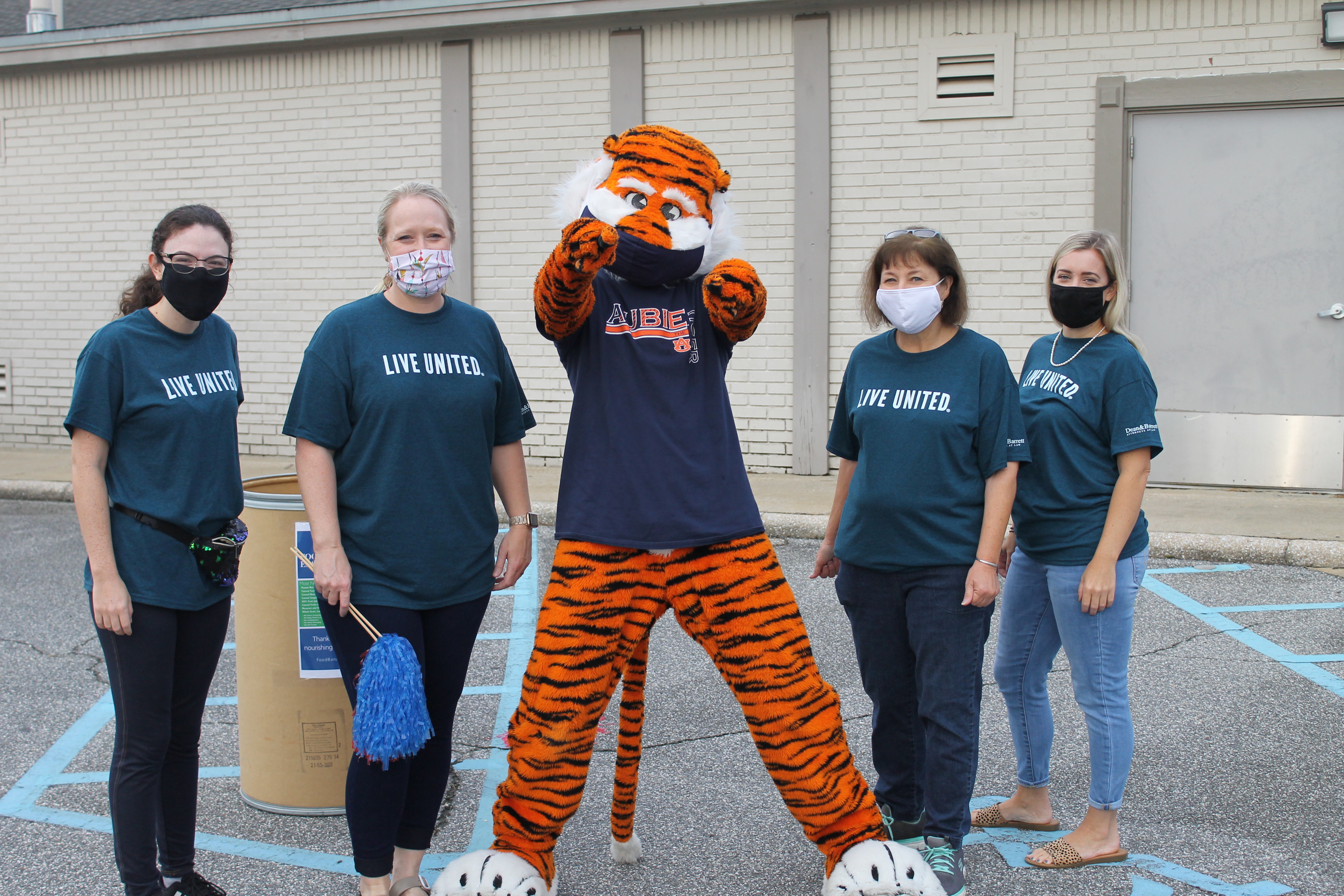 Aubie poses with United Way staff members