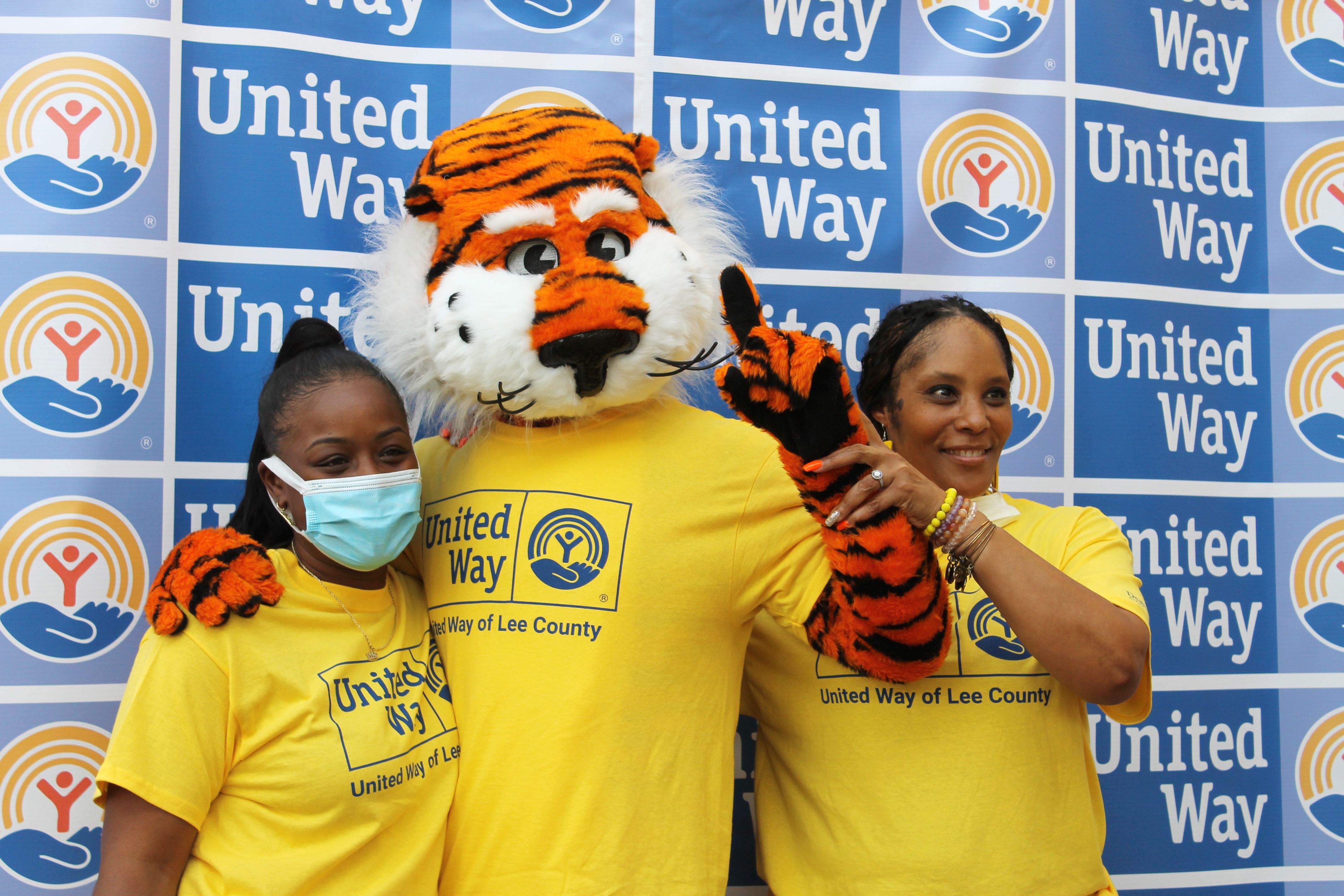 Aubie and 2 volunteers