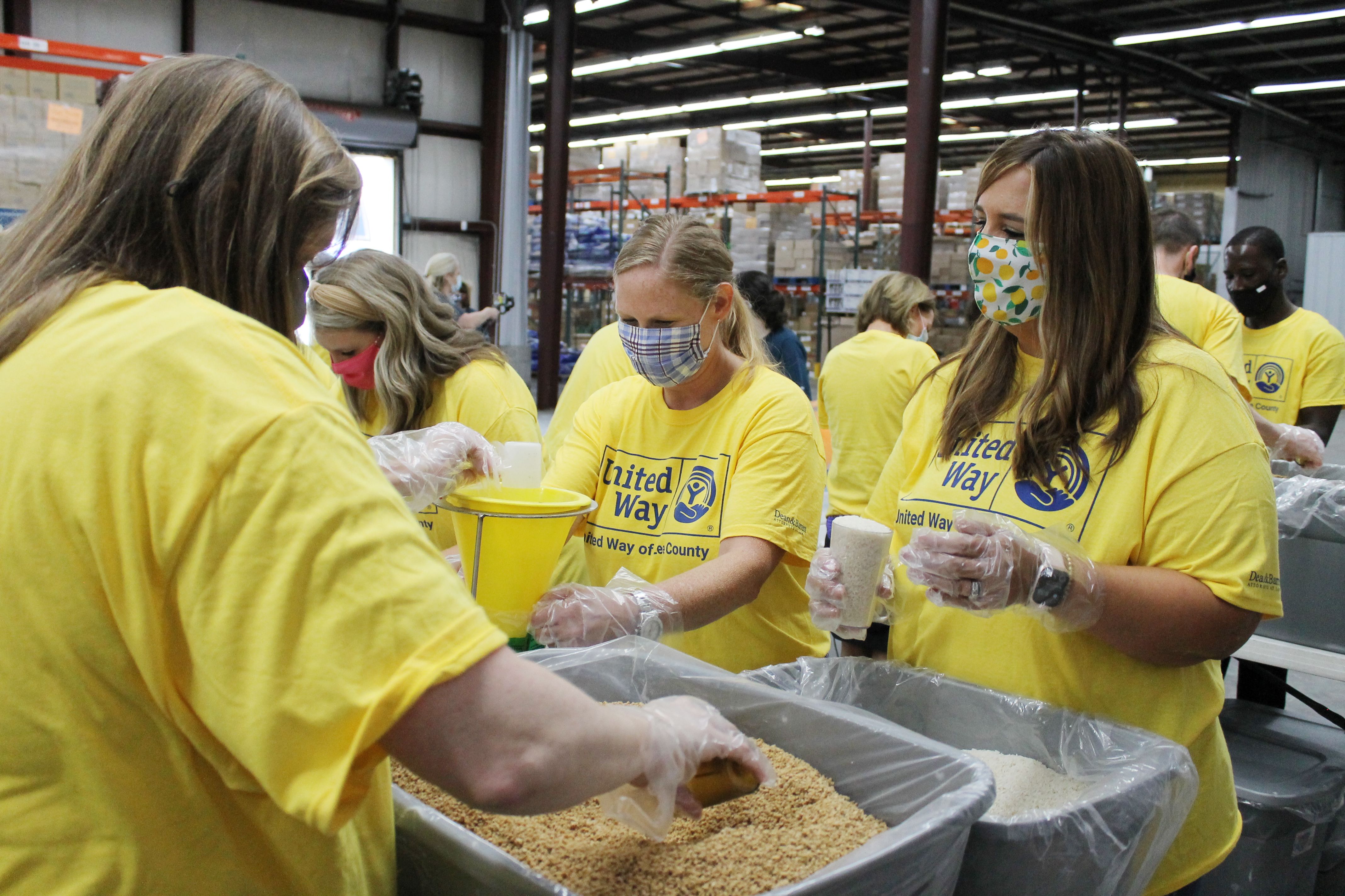 Volunteers packing food