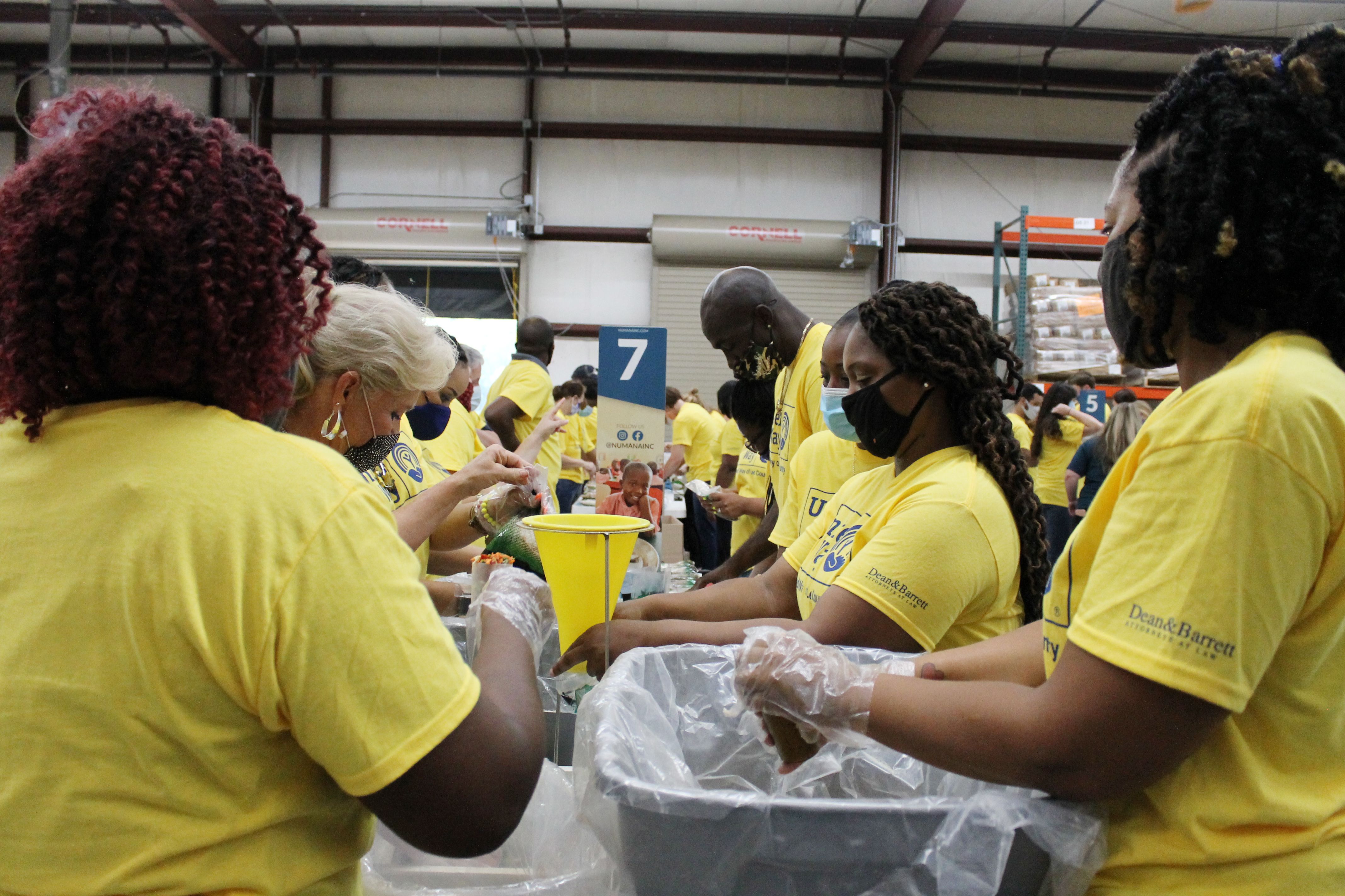 Volunteers packing food