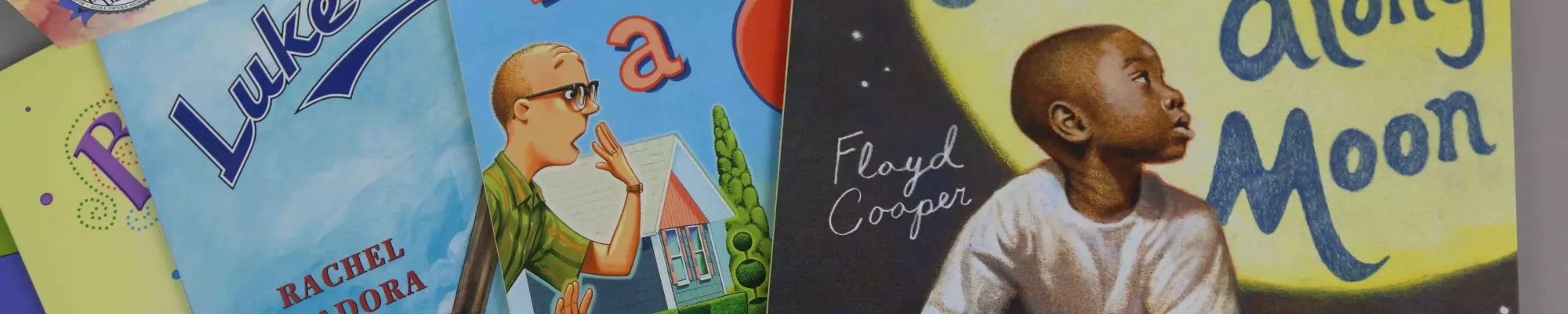 Photo of 5 children's books laid in a row.